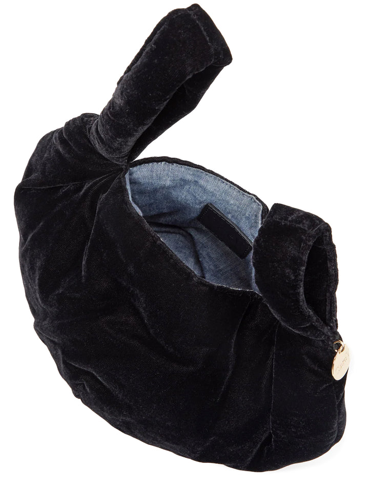 Close-up view of Clare V.'s chou chou evening bag in black velvet.