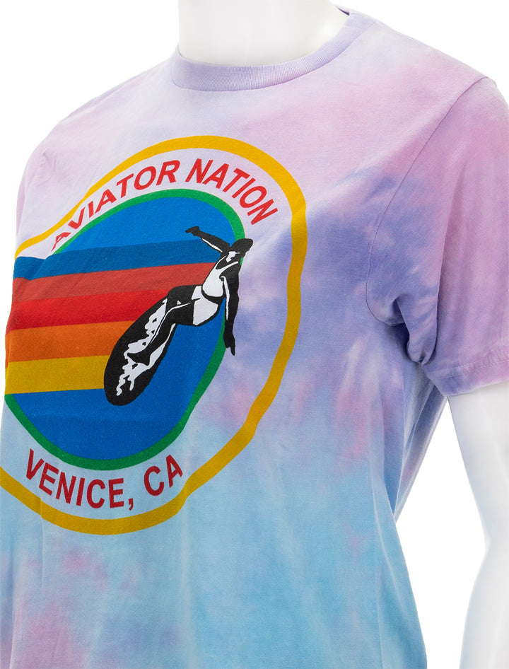Close-up view of Aviator Nation's aviator boyfriend tee in tie dye bubble gum.
