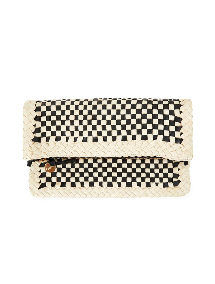 Front view of Clare V.'s foldover clutch with tabs in black and cream border woven, folded.