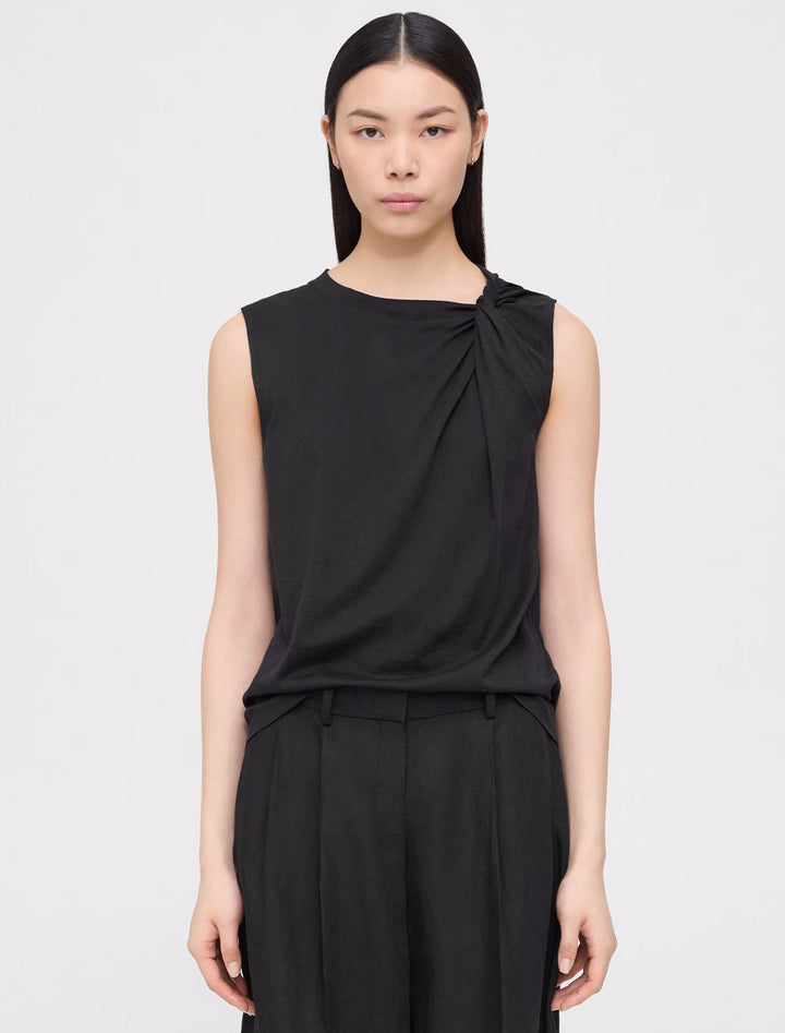 Model wearing Theory's shoulder twisted tank in black.