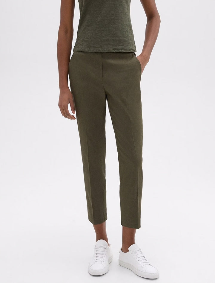 Model wearing Theory's treeca pull on pant in dark olive.