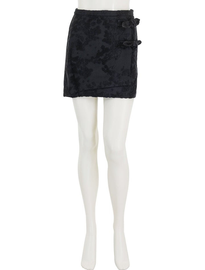 Front view of GANNI's boucle jacquard suiting mini skirt.