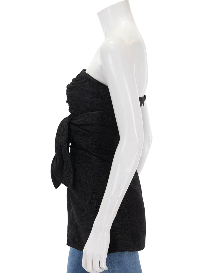 Side view of GANNI's stretch crepe strapless top in black.