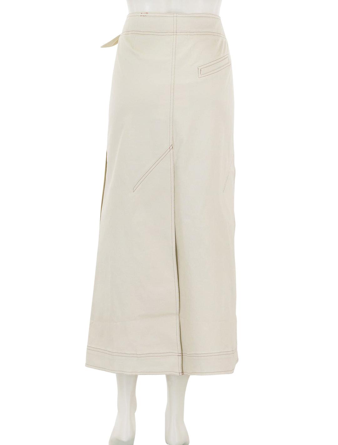 Back view of GANNI's herringbone canvas long wrap skirt in summer sand.