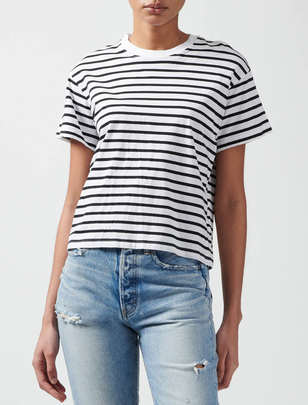 Model wearing ATM's classic jersey short sleeve stripe boy tee in black and white.