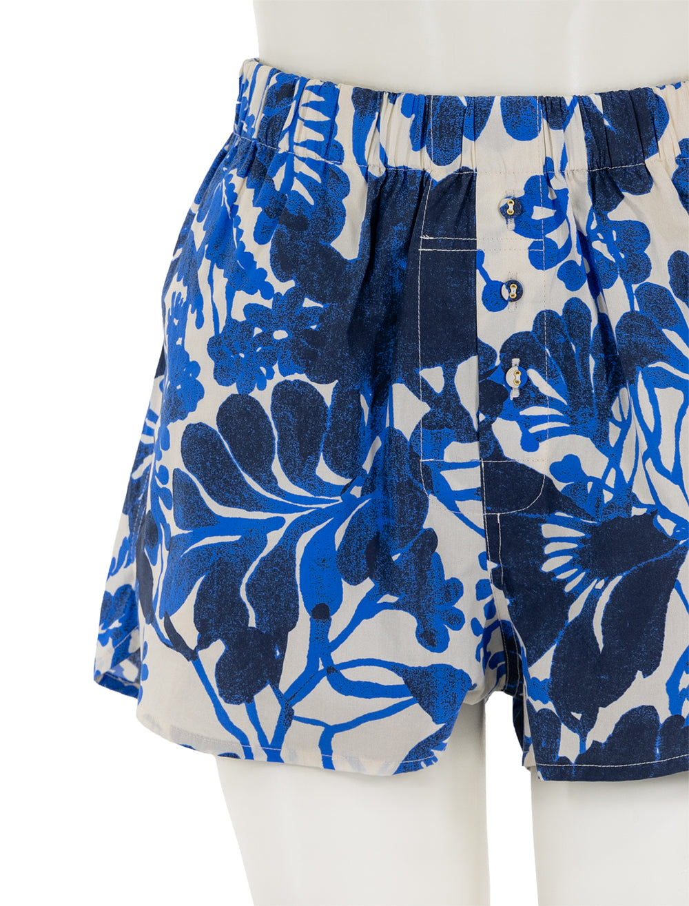 Close-up view of Cara Cara's brooks shorts in evening mill reef print.