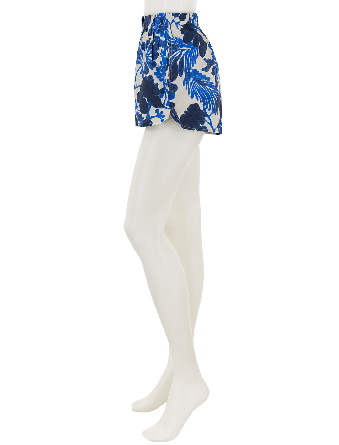 Side view of Cara Cara's brooks shorts in evening mill reef print.
