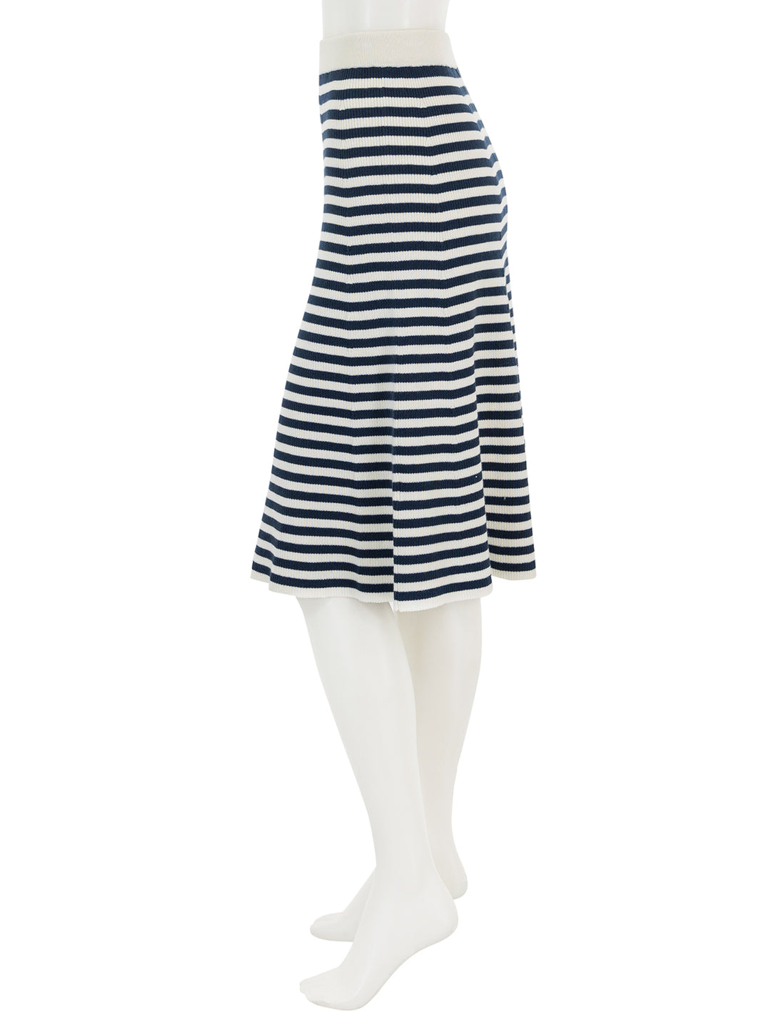 Side view of KULE's the sabine skirt in cream and navy stripe.