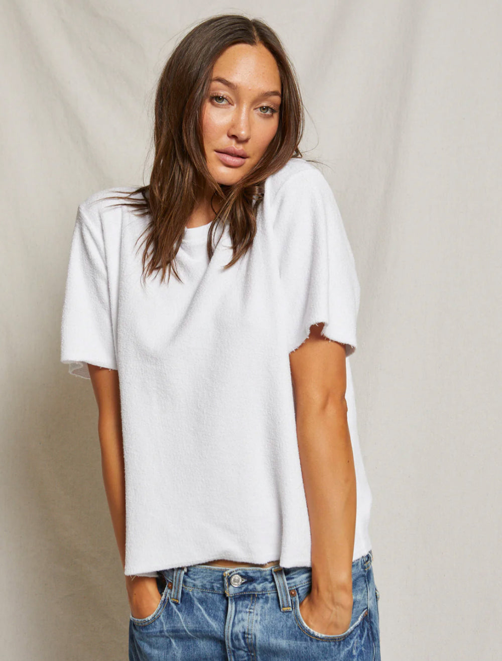 Model wearing Perfectwhitetee's demi french terry t-shirt in white.