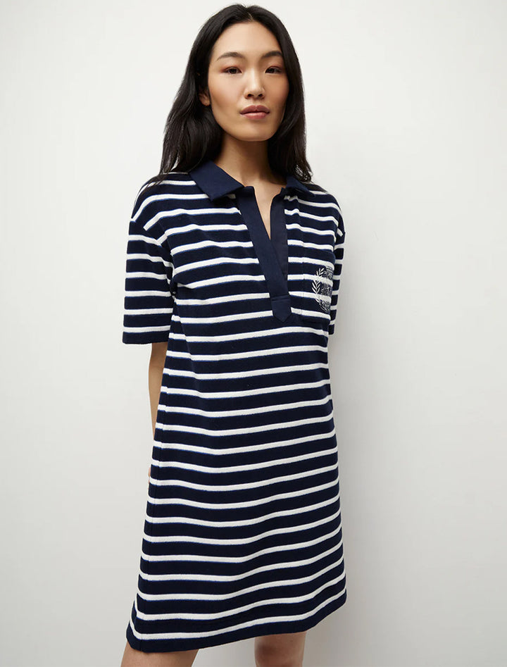 Model wearing Veronica Beard's terrence dress in marine stripe.