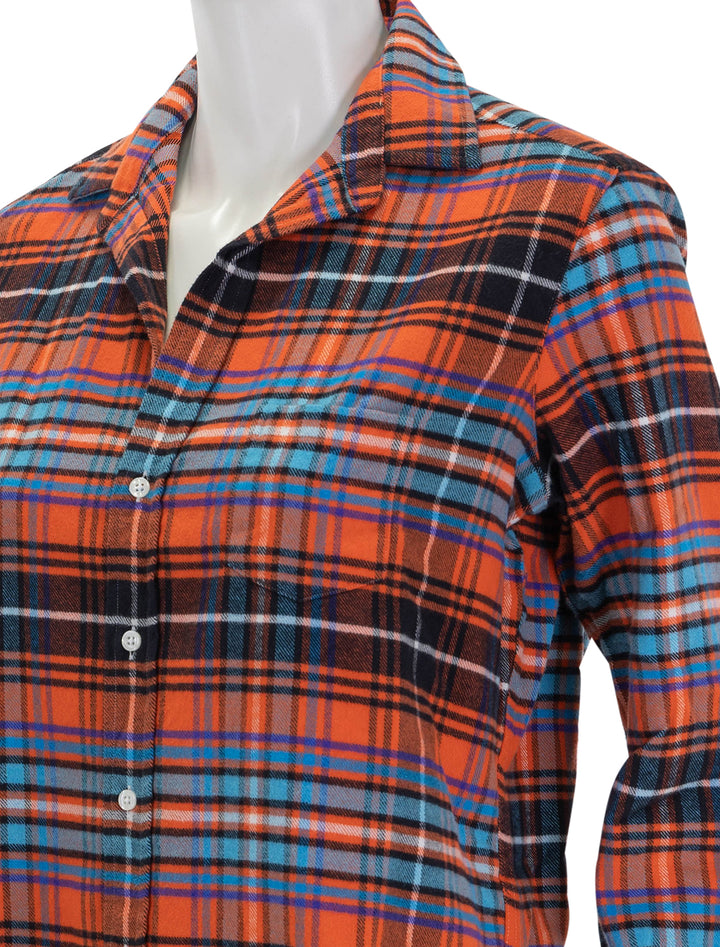 Close-up view of Frank & Eileen's eileen in orange, blue and black plaid flannel.