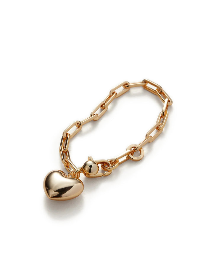 Overhead view of Jenny Bird's puffy heart chain bracelt in gold.