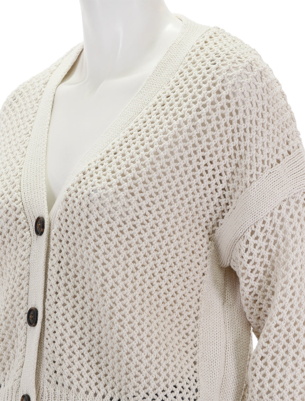 Close-up view of Self Contrast's maggie fishnet cardigan in seashell.