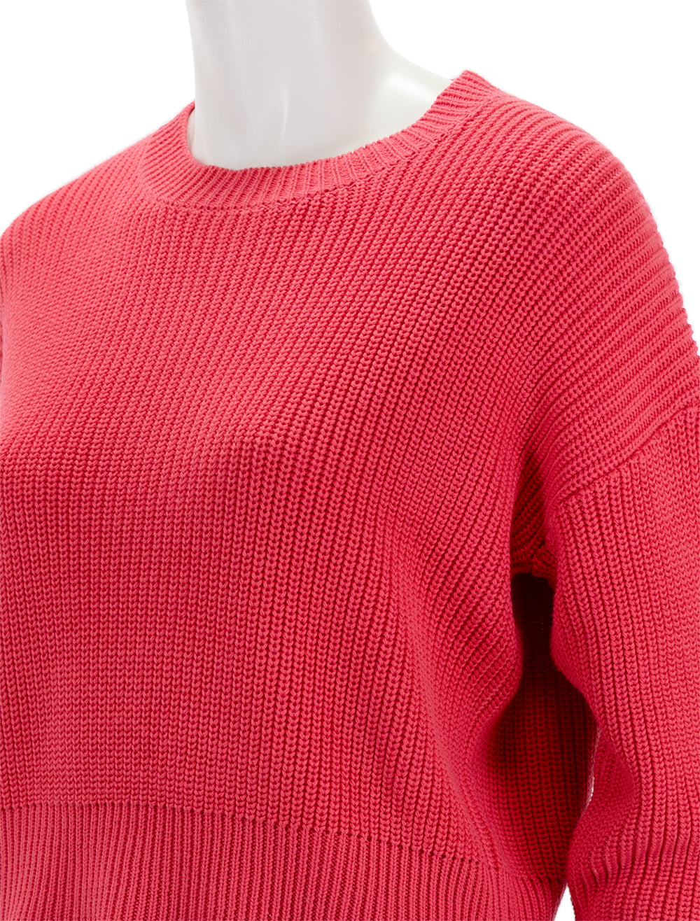 Close-up view of Self Contrast's siobhan sweater in french rose.