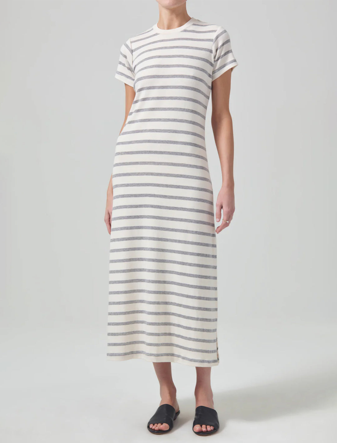 Model wearing Citizens of Humanity's goldie dress in campanula stripe.