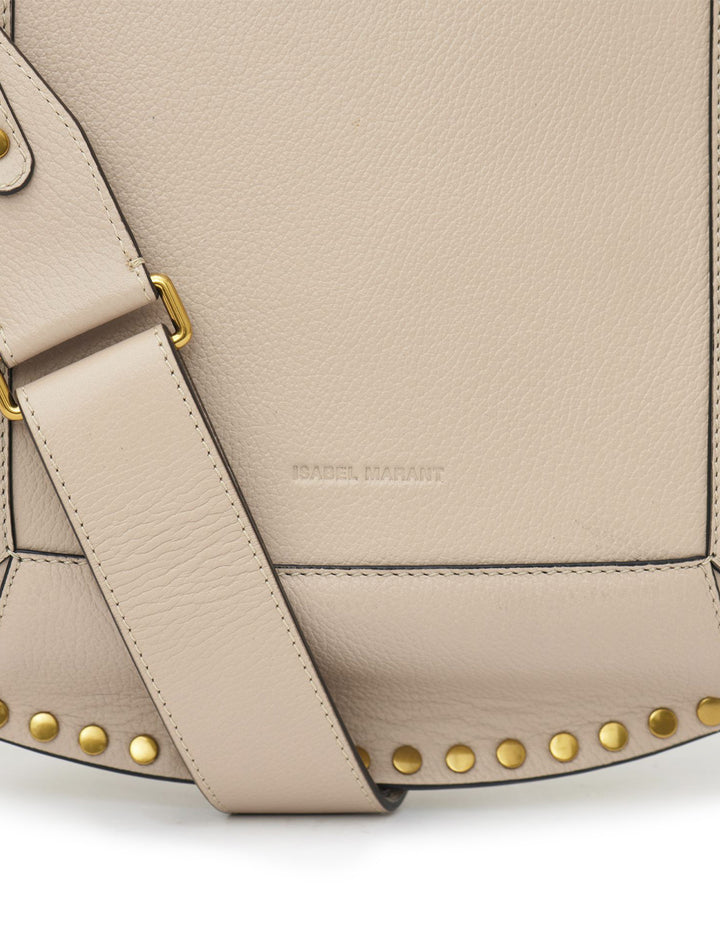 Close-up view of Isabel Marant Etoile's oksan grained leather shoulder bag in light beige.