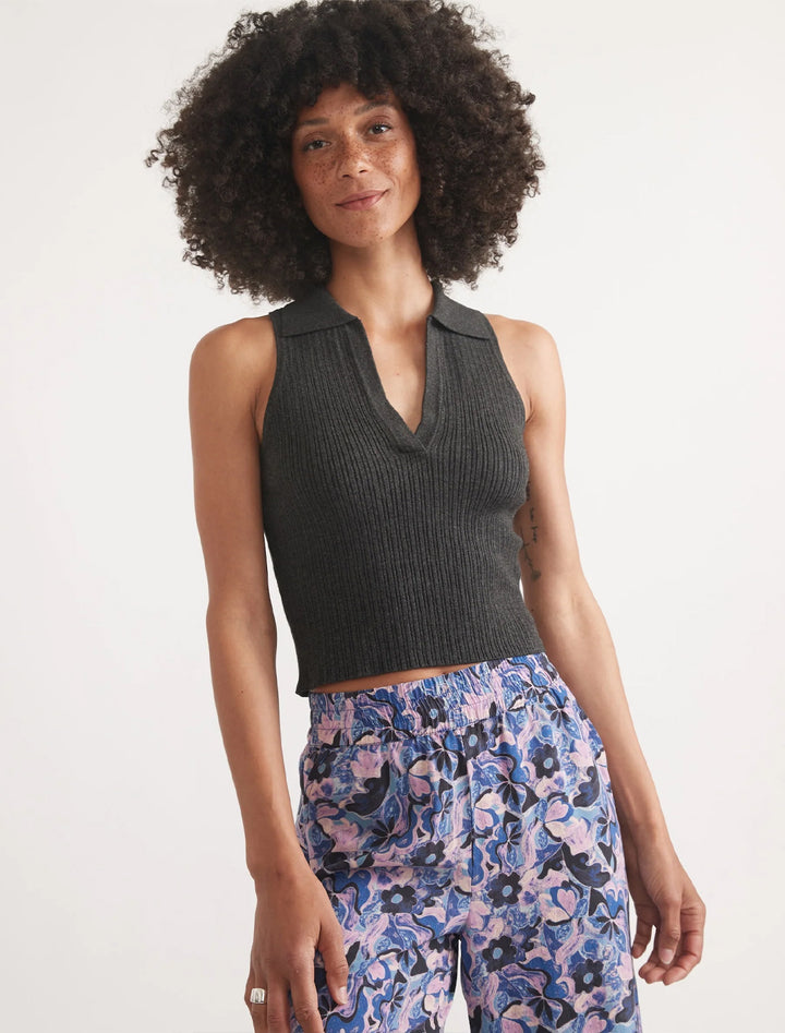 Model wearing Marine Layer's amelia rib sleeveless polo in faded black.