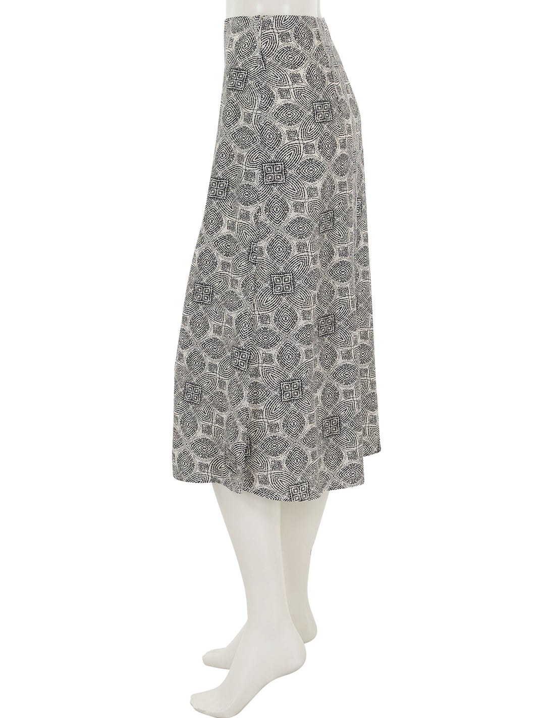 Side view of Marine Layer's ryan slip skirt in black and white mandala print.