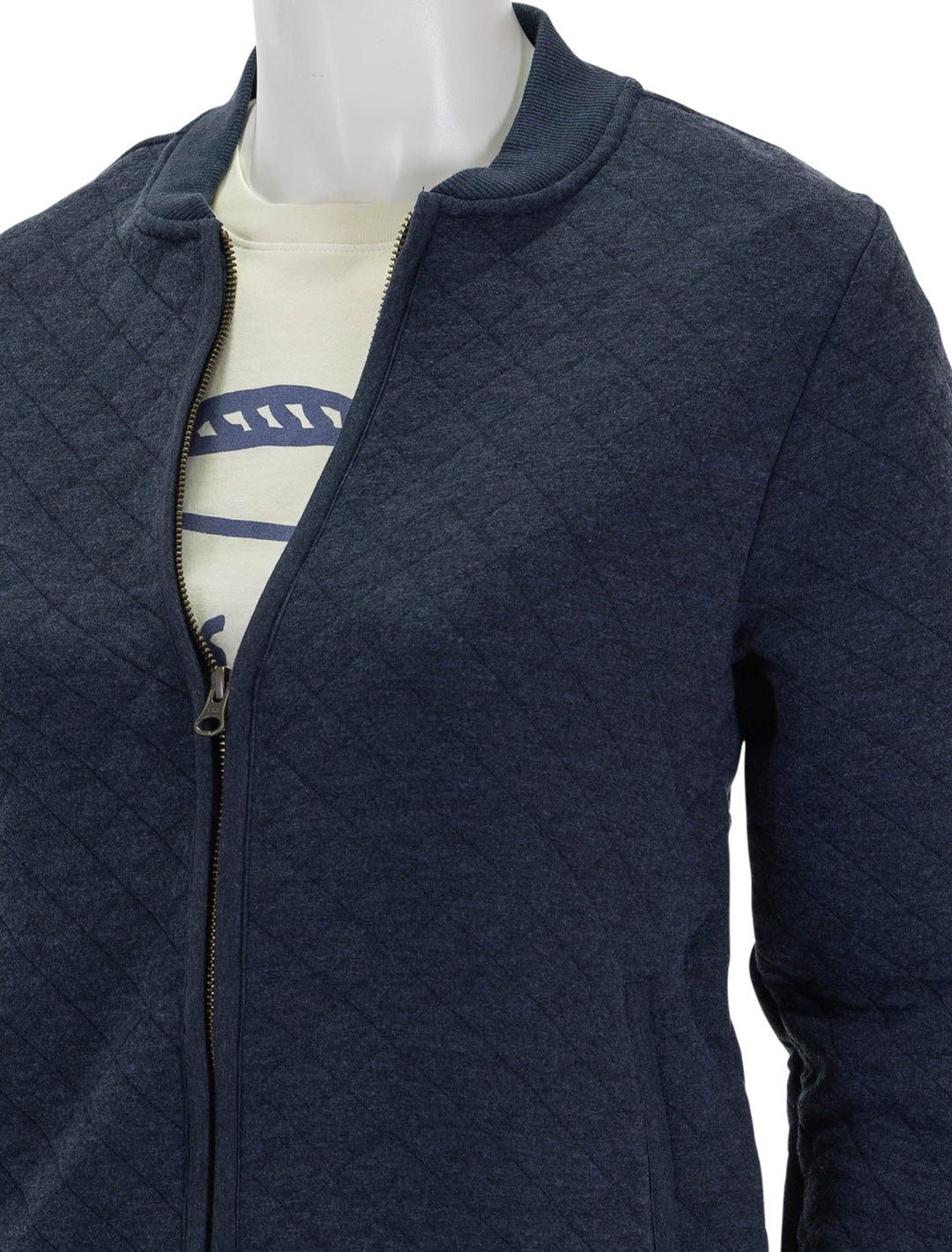 close up view of corbet quilted bomber in navy