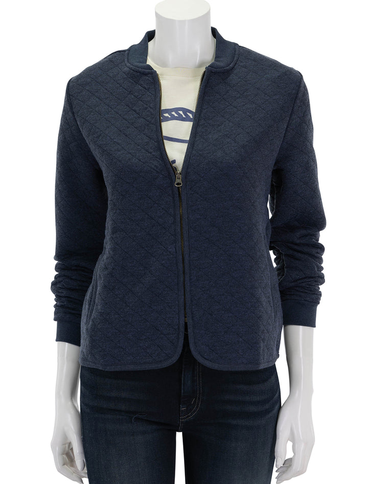 front view of corbet quilted bomber in navy zipped