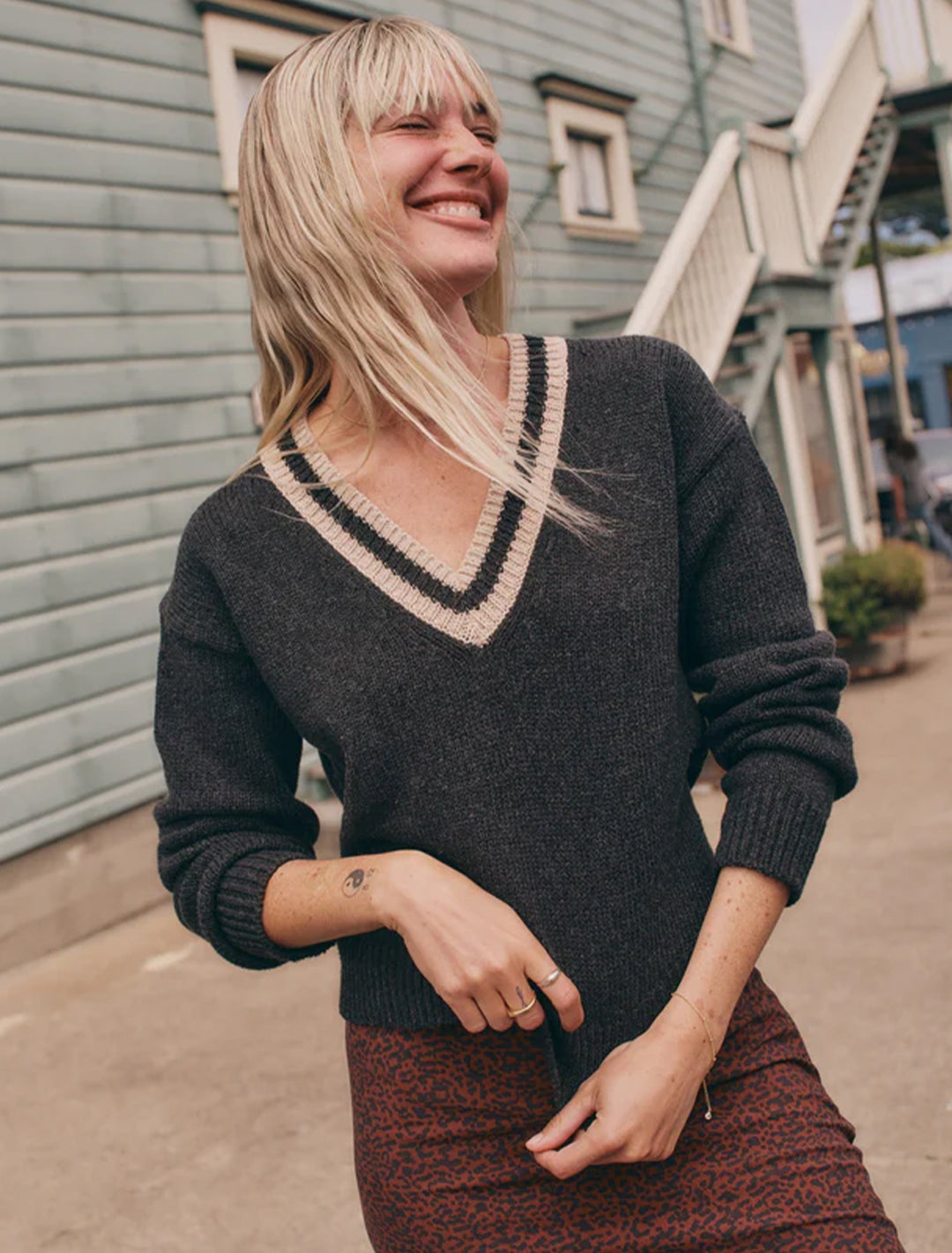 Model wearing Marine Layer's slouchy vneck sweater in black.