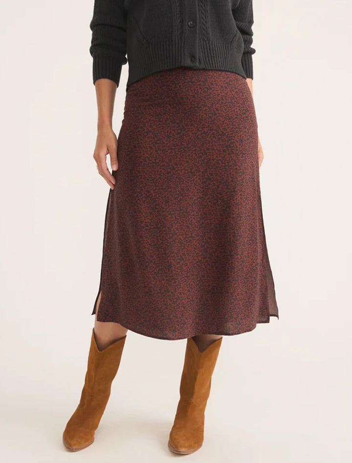 Model wearing Marine Layer's ryan slip skirt in dark cheetah.