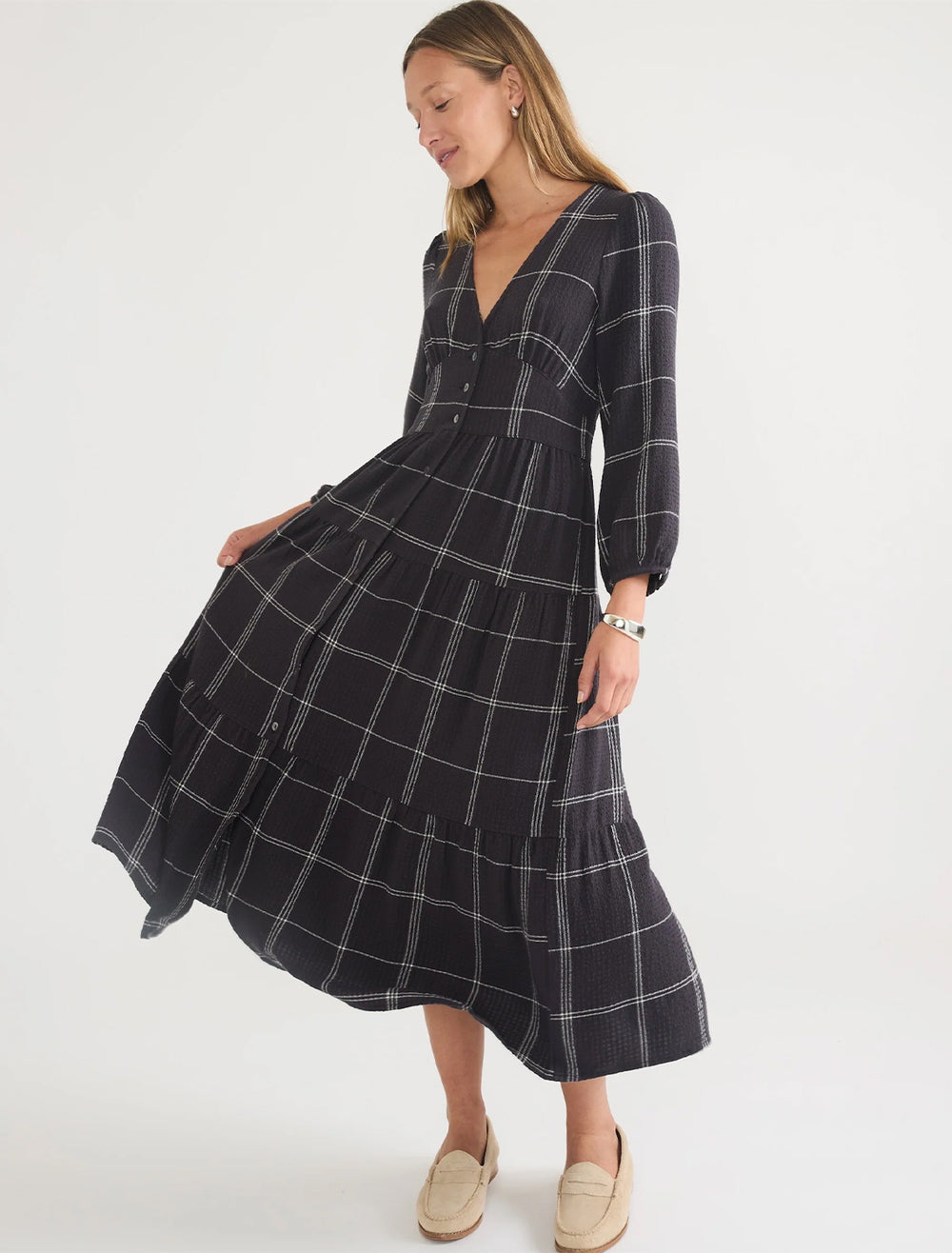 Model wearing Marine Layer's maeve maxi dress in black windowpane.