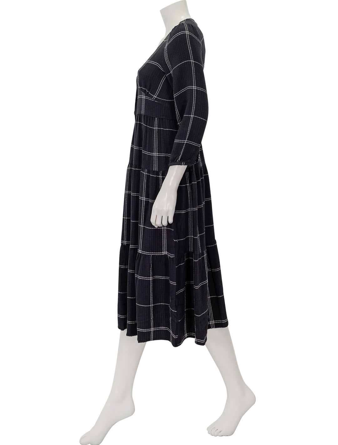 Side view of Marine Layer's maeve maxi dress in black windowpane.