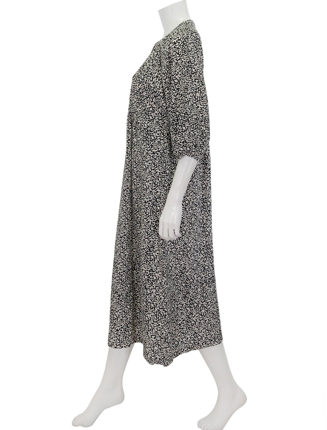 Side view of Marine Layer's lola midi dress in black and white cheetah.