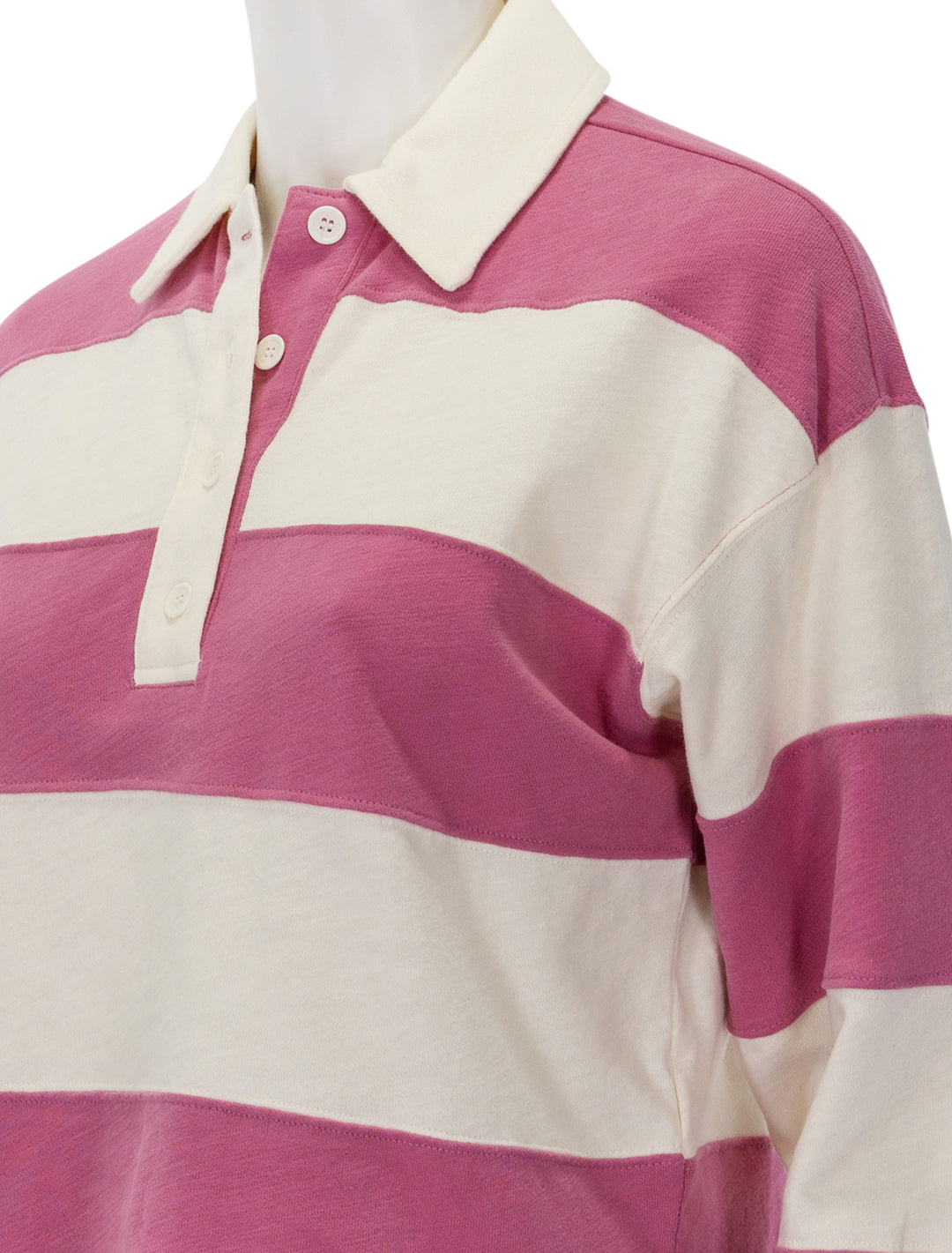 Close-up view of Marine Layer's rugby polo in raspberry stripe.