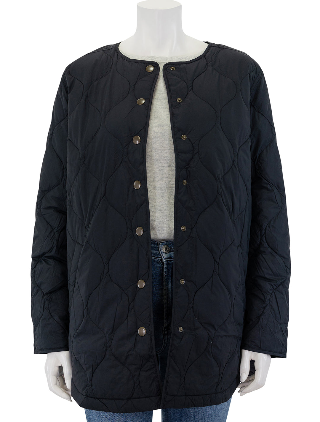 Front view of Marine Layer's mid length quilted coat in black, unbuttoned.