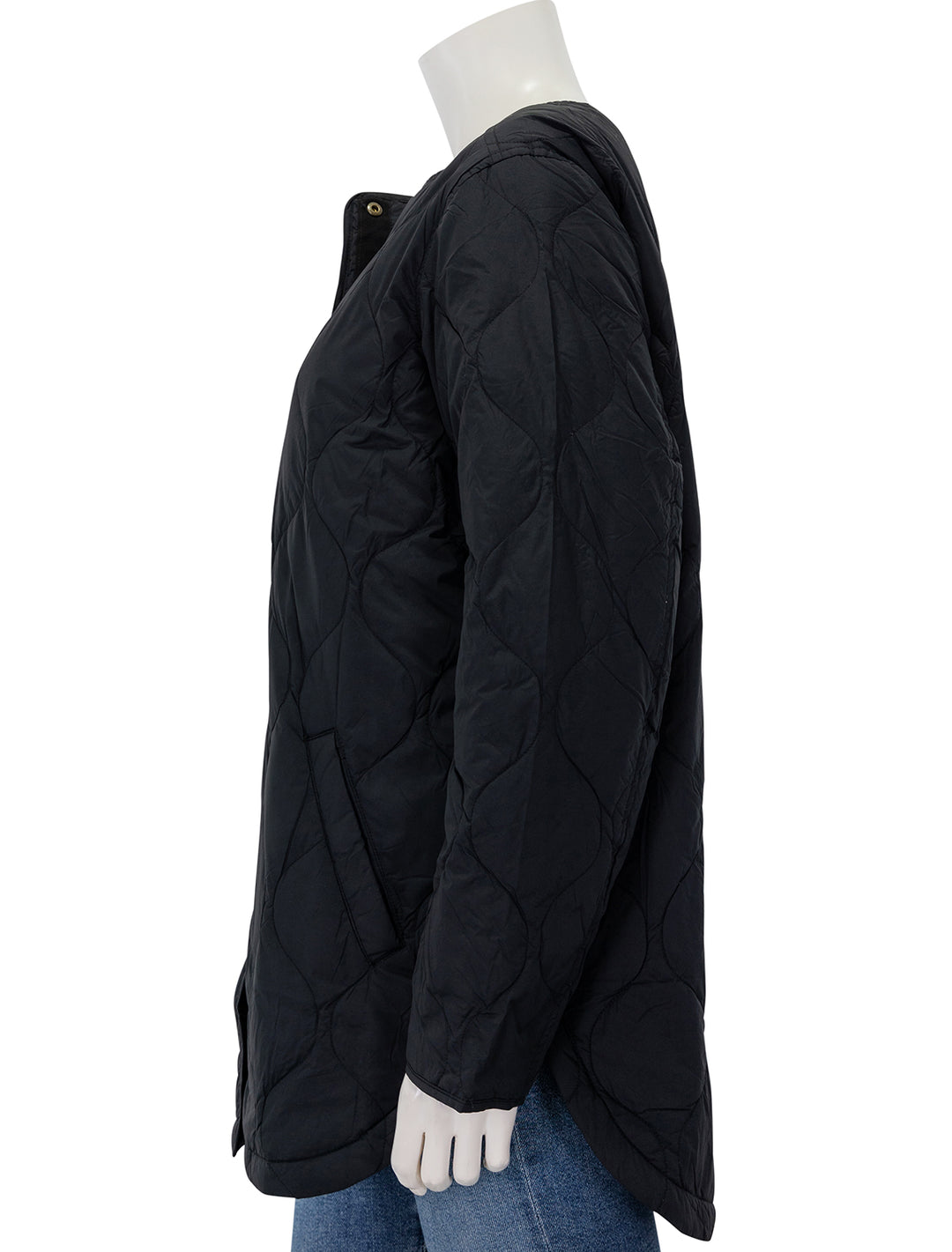 Side view of Marine Layer's mid length quilted coat in black.