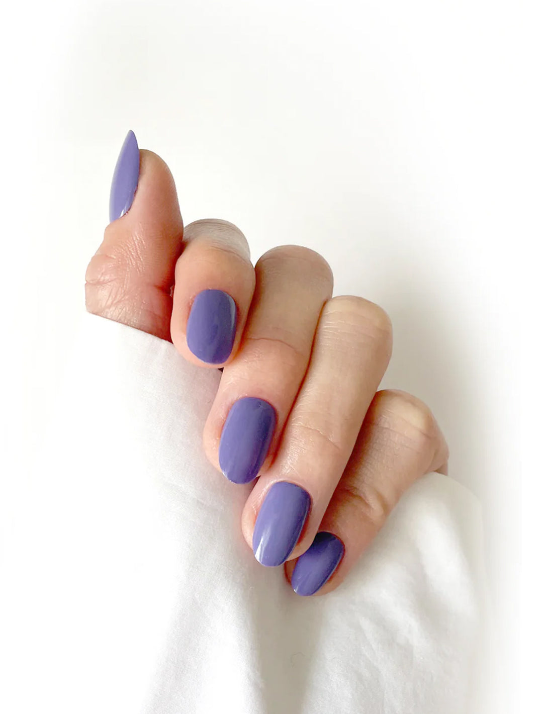 model wearing violet nail polish