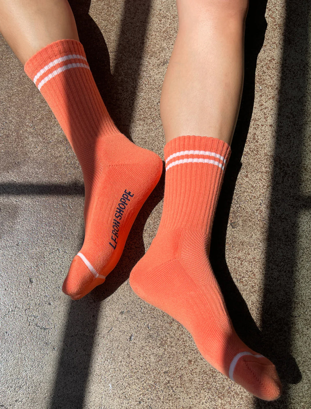 Model wearing Le Bon Shoppe's boyfriend socks in orange.
