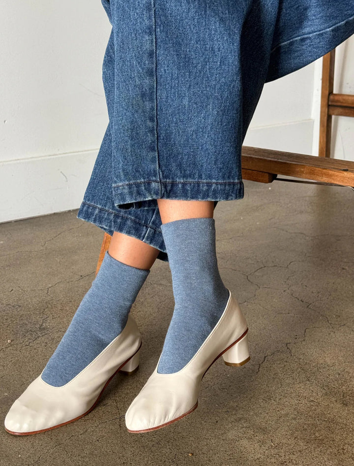 Model wearing Le Bon Shoppe's sneaker socks in denim.