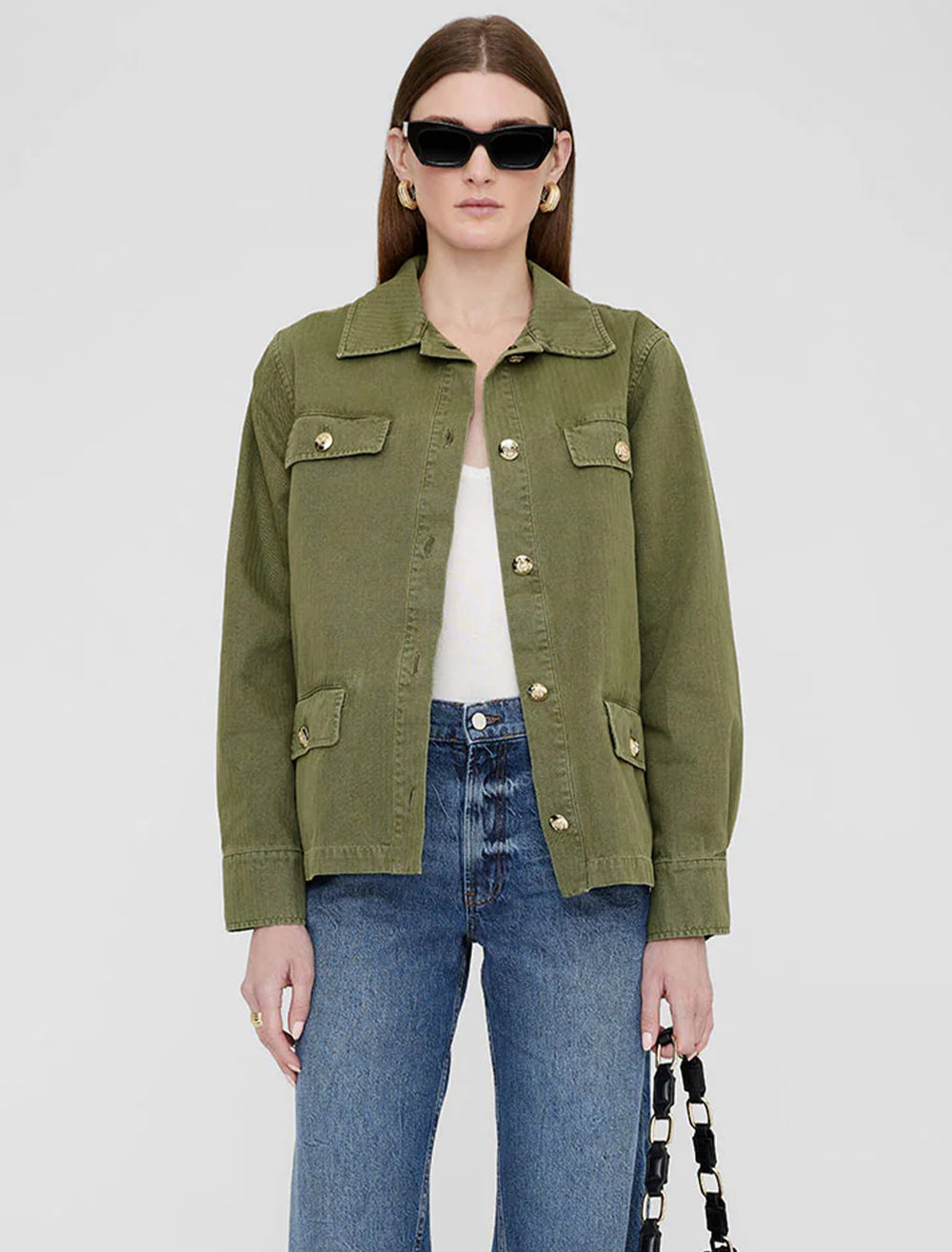 Model wearing Anine Bing's corey jacket in army green.