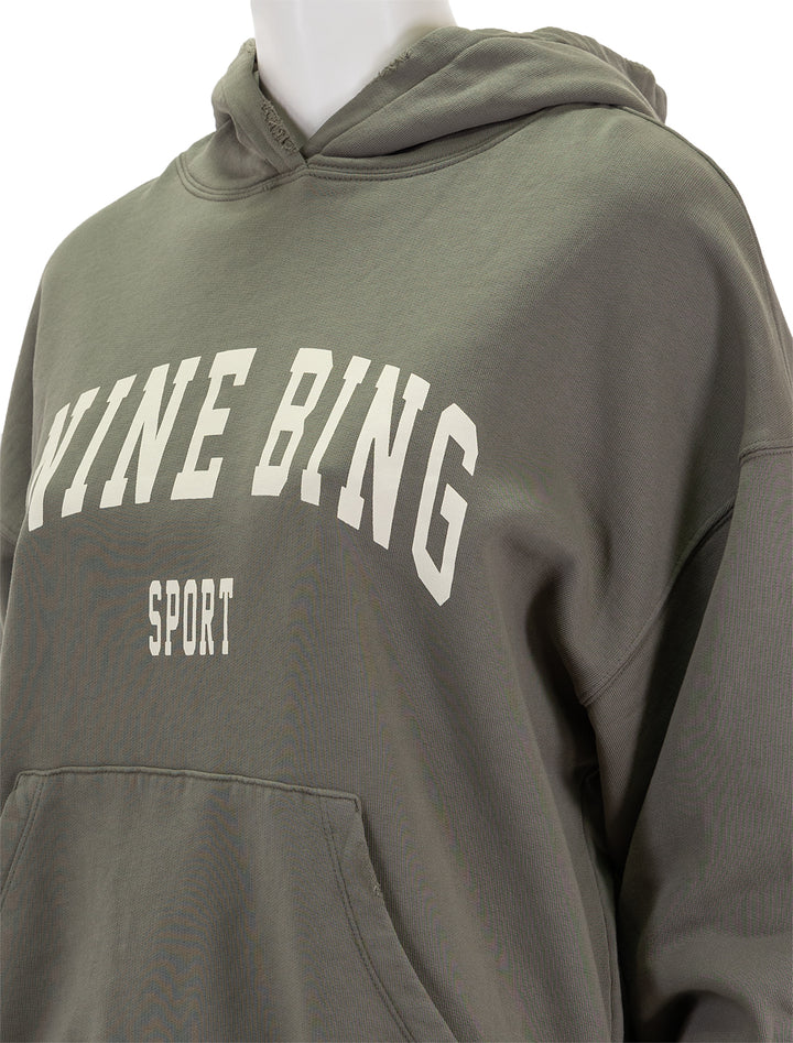 Close-up view of Anine Bing's harvey sweatshirt in dusty olive.