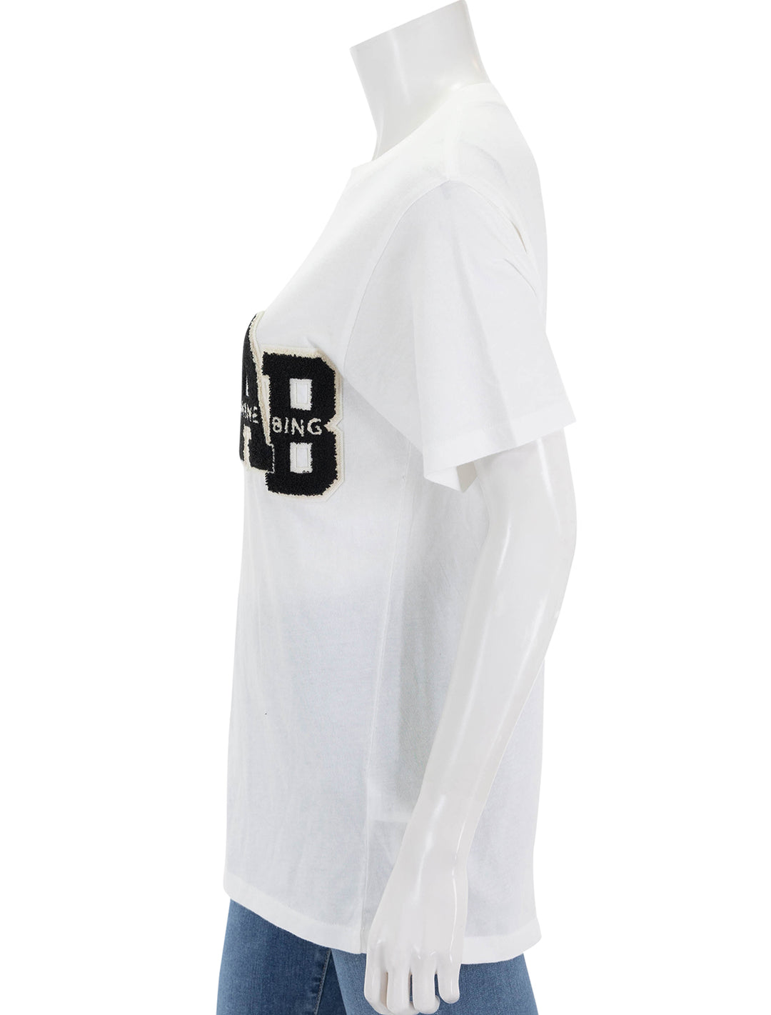 Side view of Anine Bing's lili letterman tee in off white.