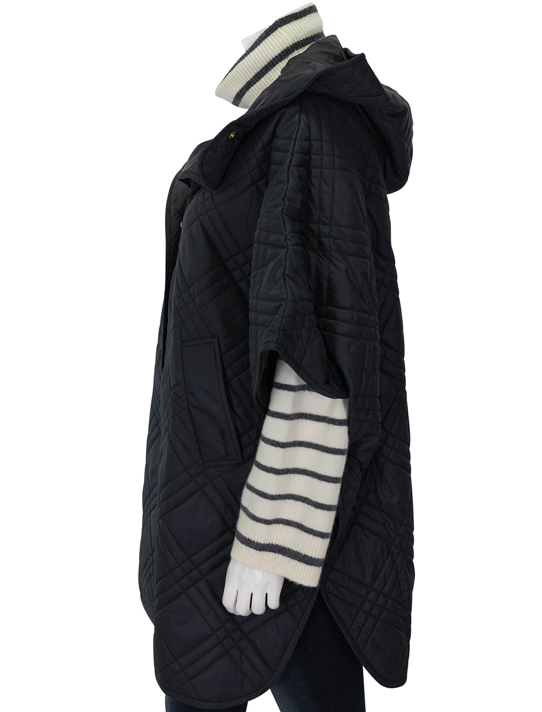 Side view of Barbour's astor quilted cape in black.