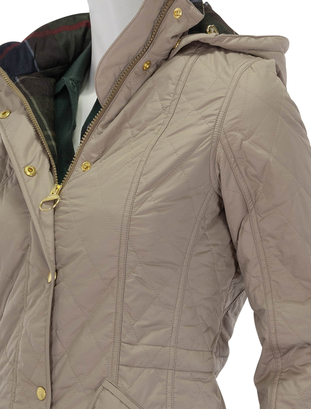 close up view of millfire quilted jacket in light trench