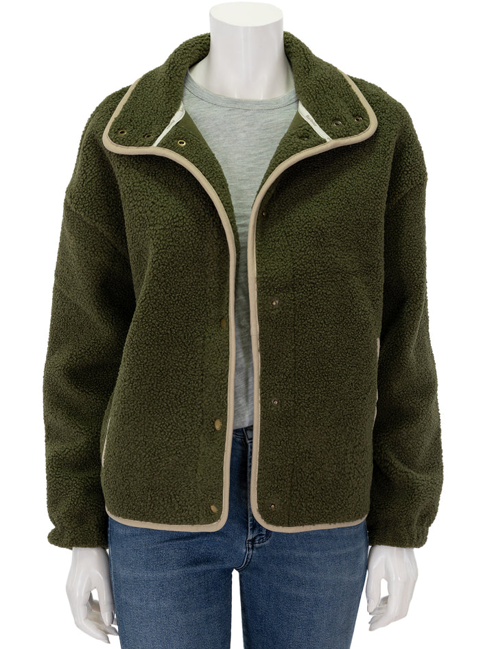 Front view of Barbour's violetta fleece jacket in dark moss, unbuttoned.