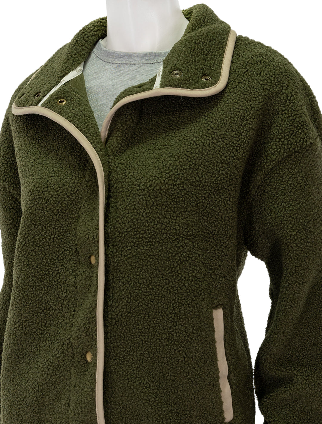 Close-up view of Barbour's violetta fleece jacket in dark moss.