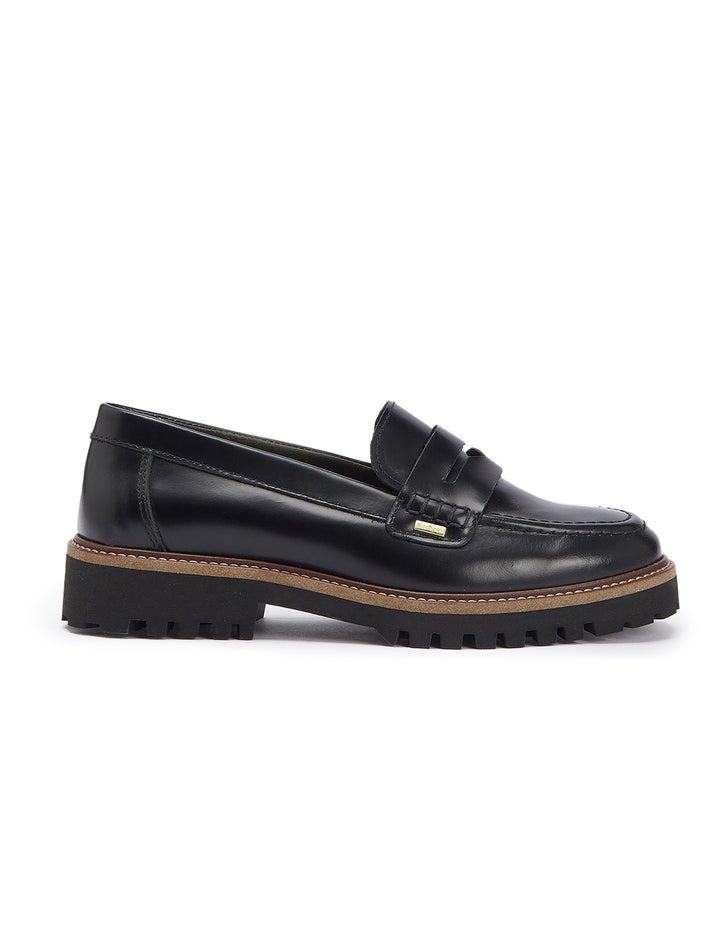 Side view of Barbour's ludlow penny loafer in black polido.