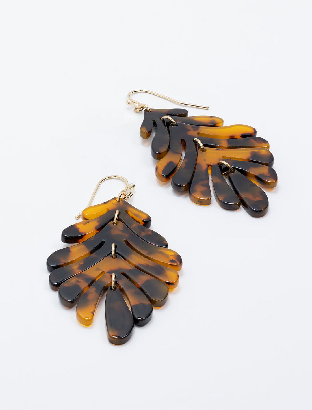 Close-up view of West Eleventh's palm leaf earrings in tortoise.