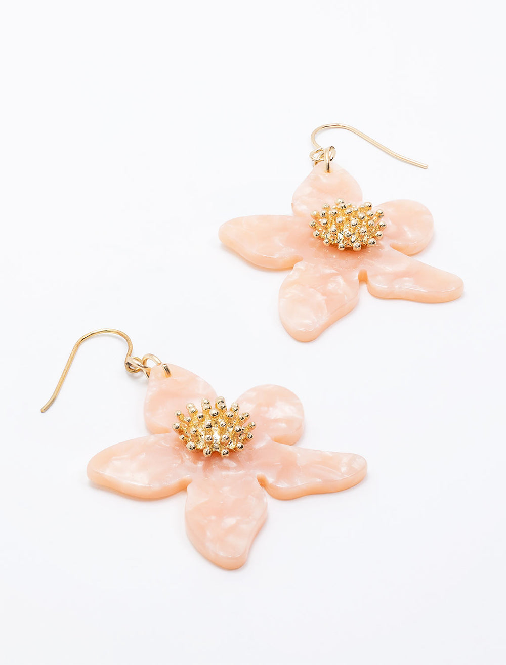 Laydown of West Eleventh's pink flower earrings.