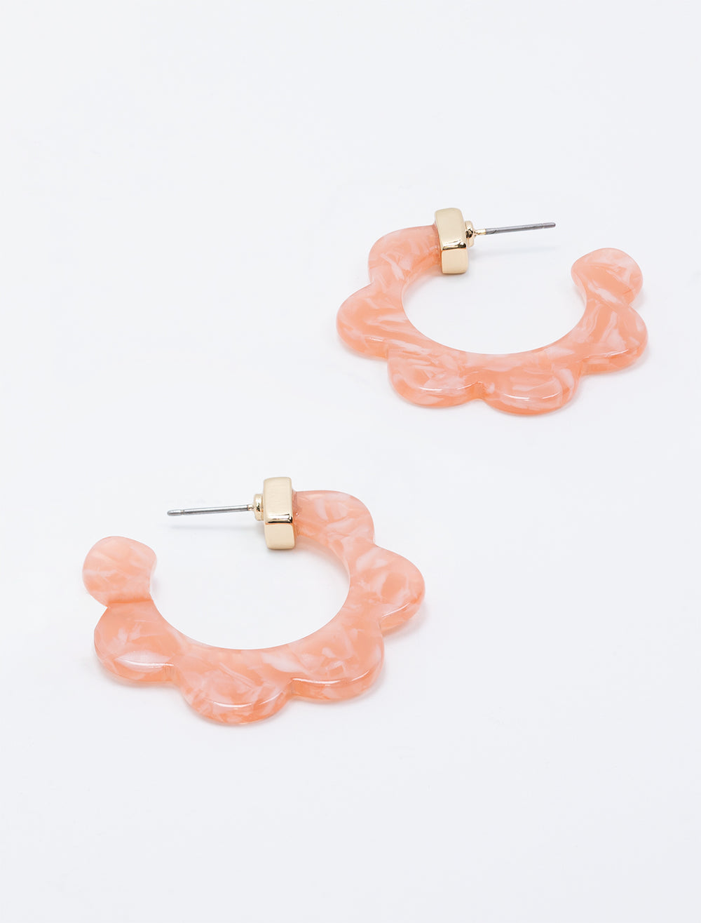 Laydown of West Eleventh's pink scallop hoops.