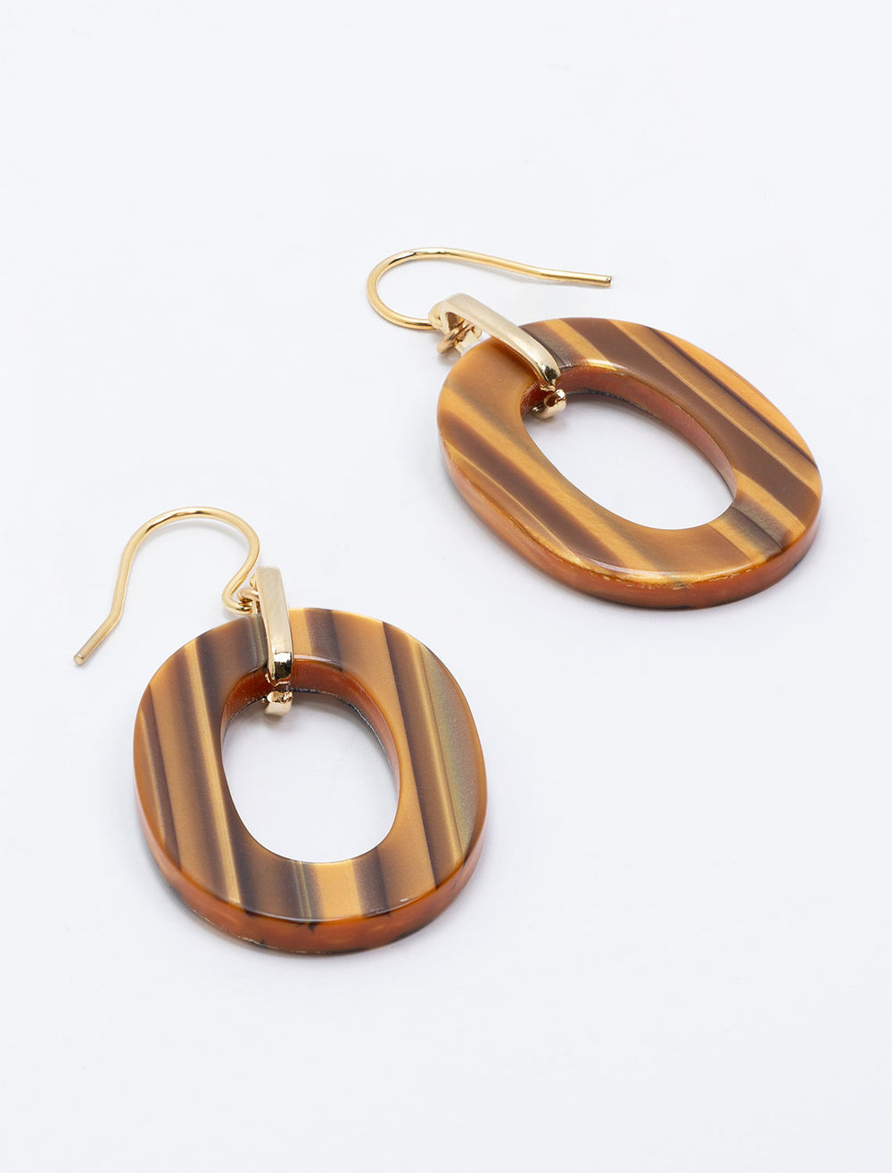 Laydown of West Eleventh's oval acacia link earrings.