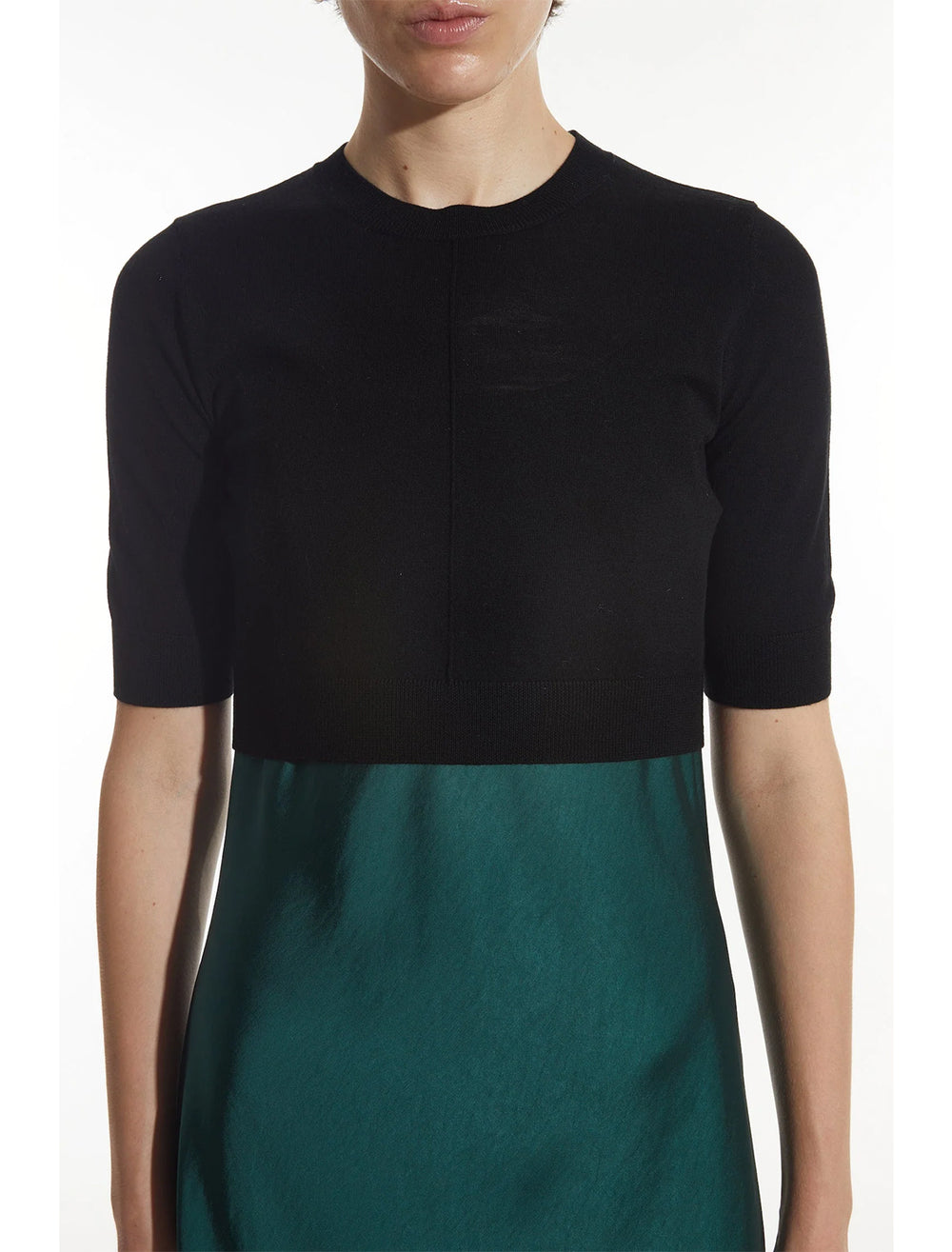 Model wearing Saint Art's norah cropped short sleeve sweater in black.