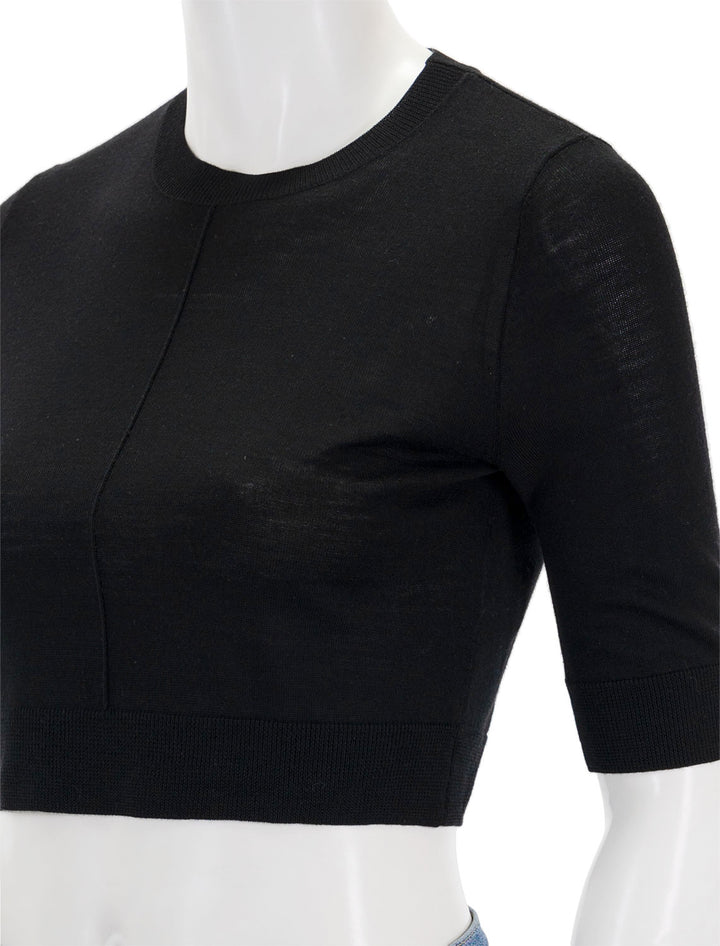 Close-up view of Saint Art's norah cropped short sleeve sweater in black.