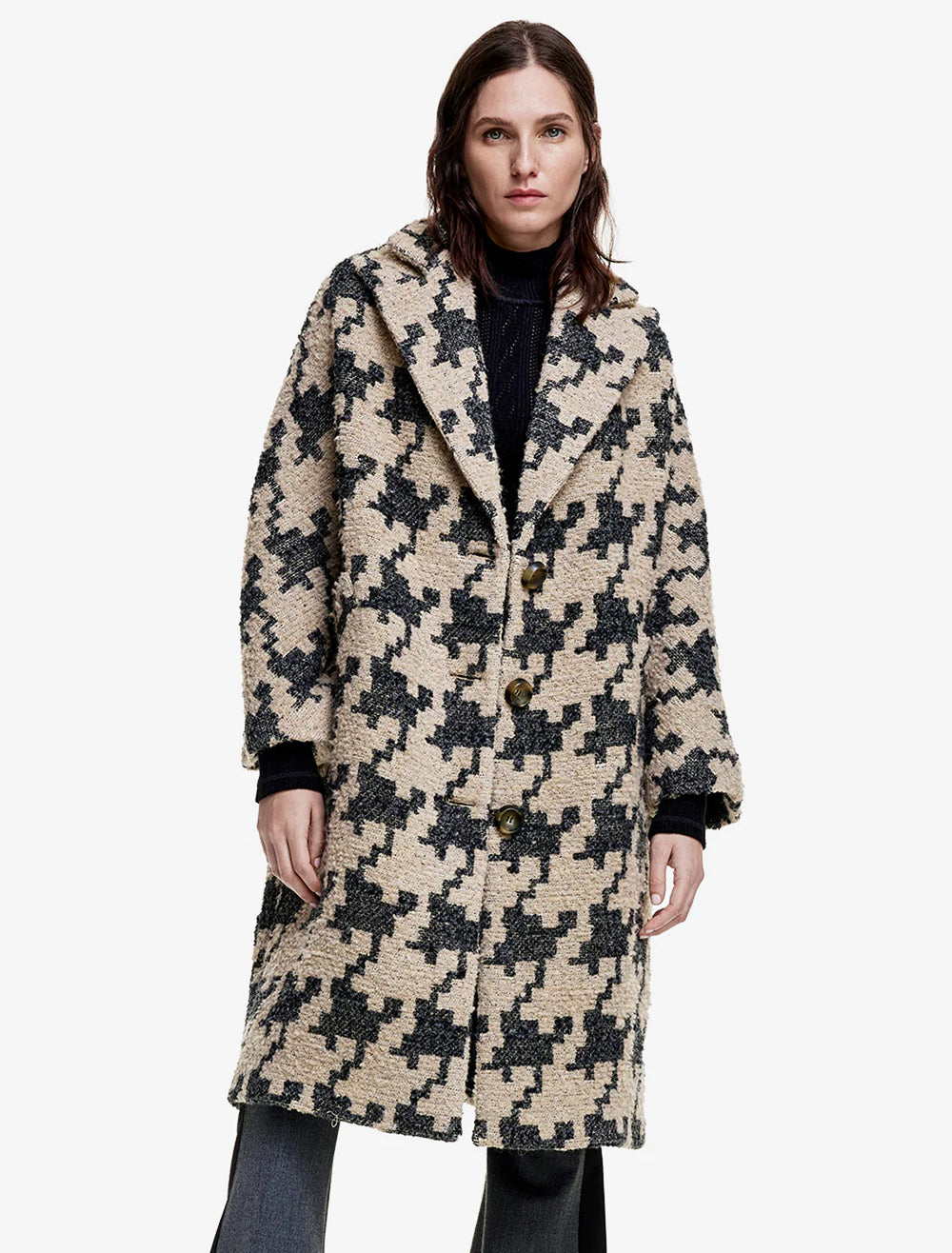 model wearing oversized swing coat in oatmeal houndstooth